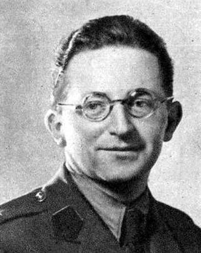 Black-and-white portrait of Marian Rejewski, a man with short dark hair and round glasses, wearing a military uniform